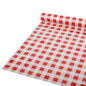 On a flat surface, there is a partially unrolled Starpak tablecloth, foil 50 m x 80 cm red "check" (1 roll), with a red and white check pattern depicted; the material appears to be a plastic film.