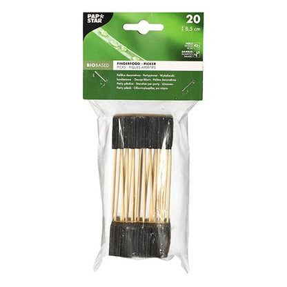 A transparent plastic package contains 20 PAPSTAR finger food picks, 8.5 cm, black - ideal for buffets and parties. The top label shows product details on a green background with white text. Brand: PAPSTAR GmbH.