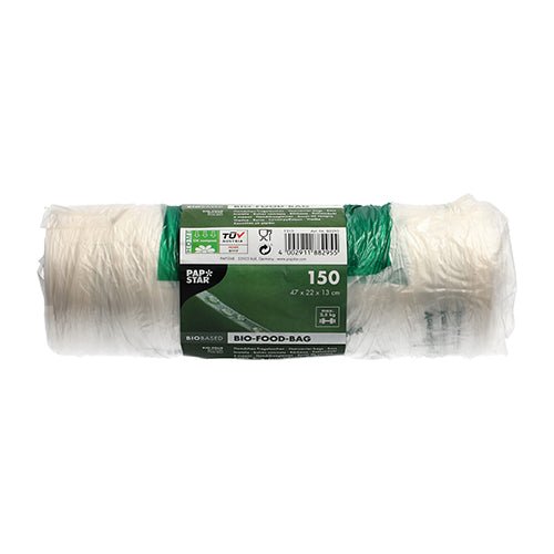 A roll with 150 PAPSTAR knot bags (47x22 cm) made of transparent bio-film from PAPSTAR GmbH shows a green-white banderole with product info and symbols, depicted unused on a white background.