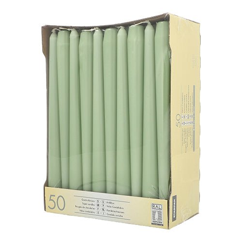 A cardboard box shows 50 Starpak taper candles (Ø 2.2 cm - 25 cm) white with long burn time, upright in rows. The front is open to view the candles; product information and the Starpak brand are printed on the sides.