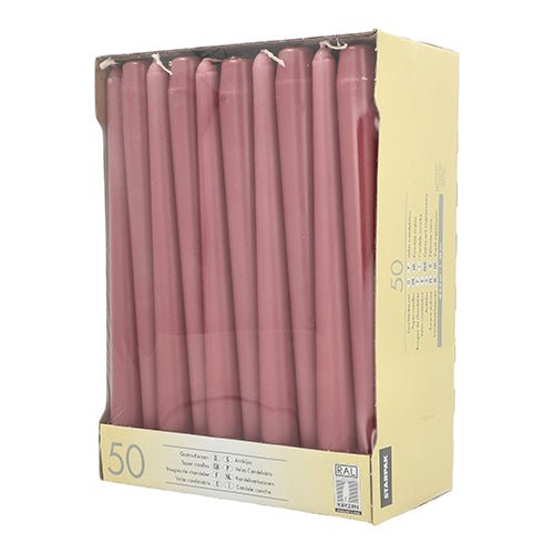 In a beige Starpak box with a clear window, 50 pink taper candles (2.2 cm × 25 cm) stand upright. The product information is printed on the lower front.
