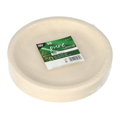 A stack of round, white disposable plates made from agricultural residues by PAPSTAR GmbH, packaged in foil with a green-white label "50 pure" and product information.