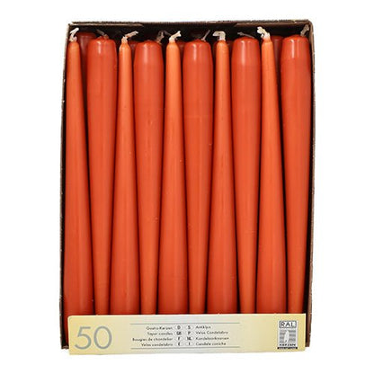 A box with Starpak 50 taper candles (Ø 2.2 cm - 25 cm), arranged upright in a single layer, with a front label stating "50 pieces" and noting the long burning time for extended use.