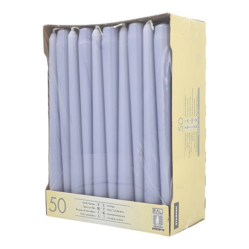 A cardboard box with 50 white Starpak taper candles Ø 2.2 cm - 25 cm, each with a long burn time, neatly arranged in two rows and wrapped in clear plastic, with product information and symbols on the front.