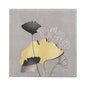 The PAPSTAR 20 napkins (33x33 cm, 3-ply, 1/4-fold) by PAPSTAR GmbH feature a gray design with five overlapping ginkgo leaves in black, yellow, and white in the center on a subtly dotted background.