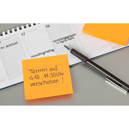 A pen lies on an open planner next to two orange Post-it® notes (76 mm x 76 mm, 100 sheets/block, 100% PEFC) from 3M Deutschland GmbH; one note reschedules an appointment to October 4th at 11:30 AM in German. Handwritten entries appear in the planner.