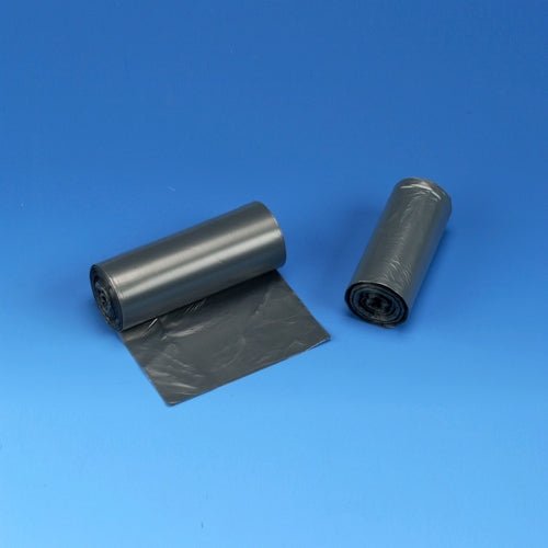 On a blue surface, there are two rolls of Starpak 50 garbage bags, HDPE 30 l (60 x 50 cm) in gray depicted, with one roll partially unrolled to present the bag.