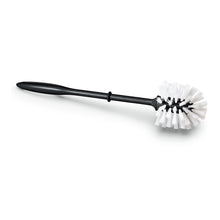 The Nölle Profi Brush toilet brush made from regranulate, black handle with white bristles, by Nölle Profi Brush Bürsten- & Pinseltechnik e.K., is durable, effective, and environmentally friendly. Pictured on a white background.