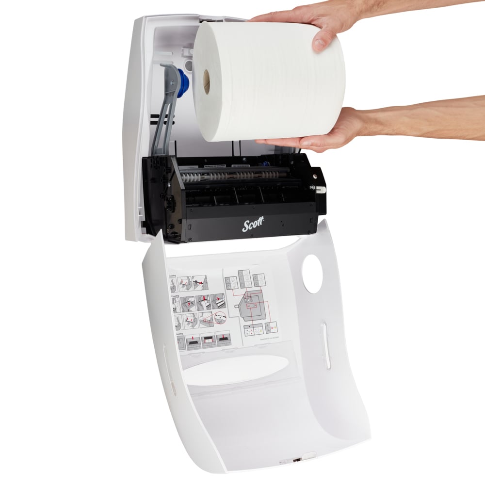 A person loads a large roll into a Kimberly-Clark Professional™ Electronic No Touch Dispenser (White, 1 dispenser), wall-mounted, with visible loading instructions for hygienic use. Brand: Kimberly-Clark GmbH.