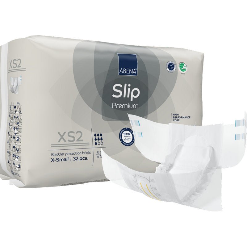 A pack of ABENA Slip Premium from Abena Re-Seller GmbH, size X-Small, with 32 bladder protection slips. A slip is unfolded at the front showing its design for effective incontinence care.