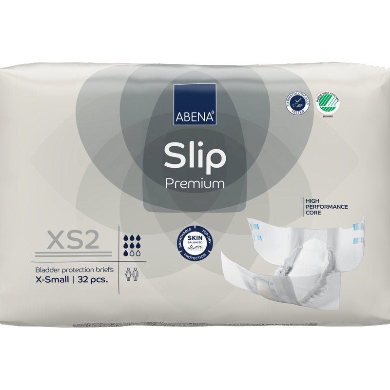 A 32-pack of ABENA Slip Premium from Abena Re-Seller GmbH in size XS2 X-Small in beige packaging with the certifications "High Performance Core" and "Skin Friendly" for reliable incontinence care.
