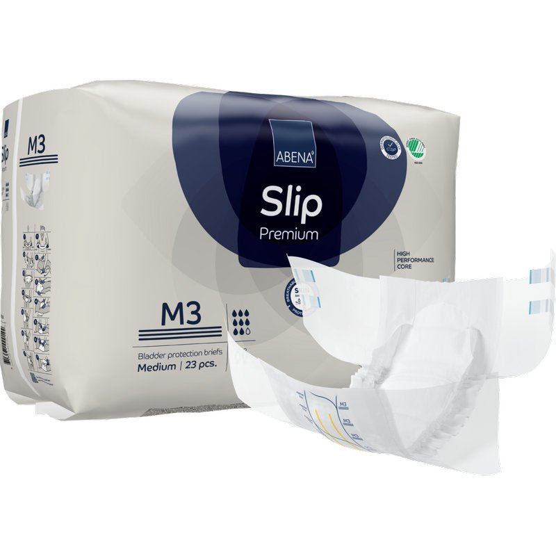 Pictured is a pack of ABENA Slip Premium from Abena Re-Seller GmbH with a medium slip outside the packaging. The pack contains 23 slips for reliable incontinence care.