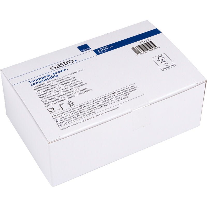 A white cardboard box with the label "Toothpicks, 65 mm, Unpacked, Wood | Pack (1000 pieces)" from Abena Re-Seller GmbH with product information, symbols, and a barcode on a blue and white label.