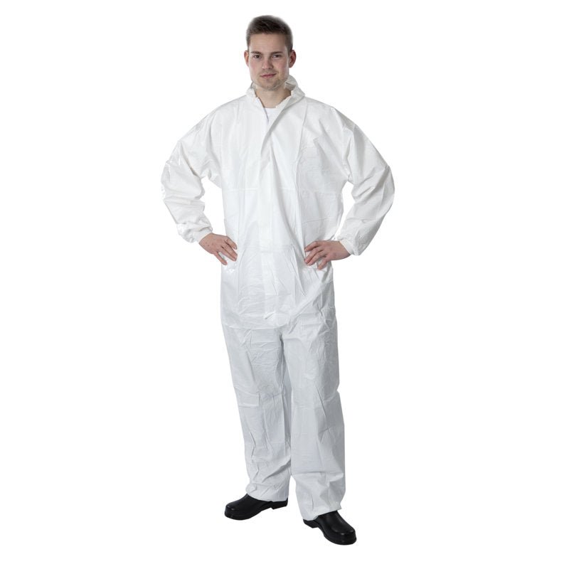 A person stands with the Thor disposable overall Type 5+6, PE, White from Abena Re-Seller GmbH with a front zipper and black shoes in front of a plain white background.