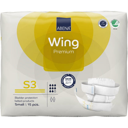 Package of ABENA Wing Premium belt slips by Abena Re-Seller GmbH, size S3, 15 pieces. The white packaging with yellow accents highlights the protection and comfort features and shows an image of the slip.
