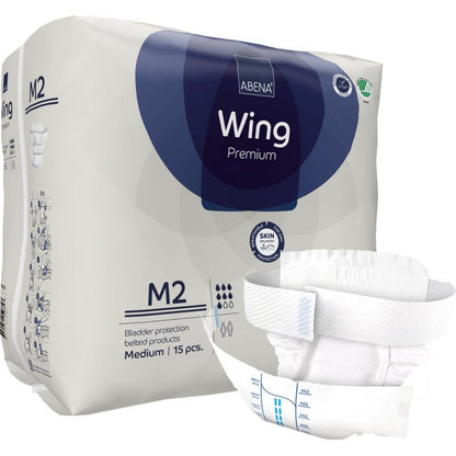 Shown is a package of Abena Re-Seller GmbH ABENA Wing Premium, containing 15 medium-sized incontinence products with a belt. A product is depicted on the front, highlighting ultimate protection for adults.