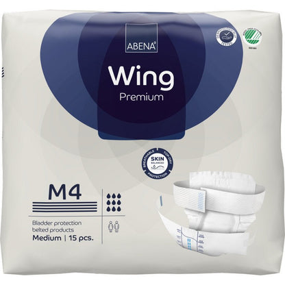 A pack of ABENA Wing Premium by Abena Re-Seller GmbH (medium, 15 pieces) with packaging for protection and comfort, product images, brand logo, and symbols for absorbency and skin protection.