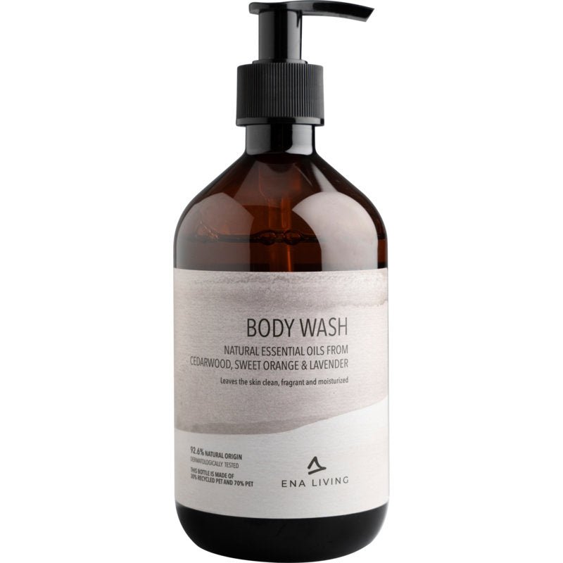 The ENA Living Body Wash, 500 ml from Abena Re-Seller GmbH (carton with 8 packs), provides moisturizing care with essential oils from cedarwood, orange, and lavender. The white design emphasizes the gentle body wash lotion.