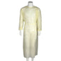 The Abena Re-Seller GmbH isolation gown for tying, Yellow, PP/PE is a yellow disposable isolation gown with long sleeves and waist tie, displayed on a white mannequin - ideal as medical disposable clothing in healthcare.