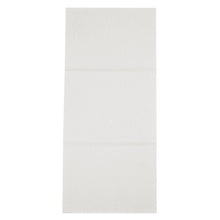 An unfolded rectangular disposable towel, airlaid, white from Abena Re-Seller GmbH lies flat on an even surface with visible crease marks.