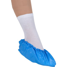 A foot in a white sock is protected by Abena Re-Seller GmbH overshoes, 15 cm 35 my CPE, blue, which provide practical disposable overshoes for hygienic protection.