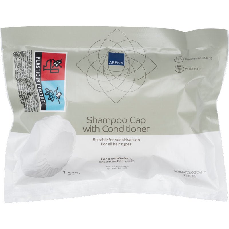 A sealed package from Abena Re-Seller GmbH contains a white shampoo cap (ø 32 cm), dermatologically tested, suitable for sensitive skin and all hair types - ideal for use without rinsing (washing hair without water).