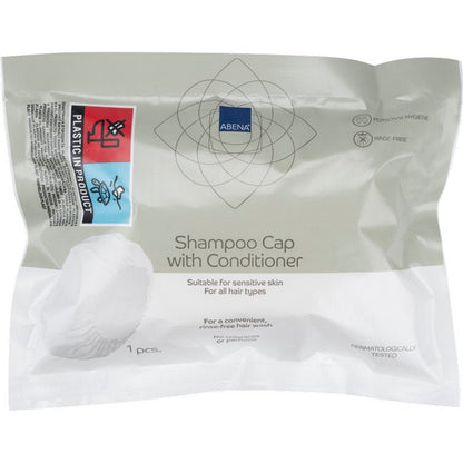 A sealed package from Abena Re-Seller GmbH contains a white shampoo cap (ø 32 cm), dermatologically tested, suitable for sensitive skin and all hair types - ideal for use without rinsing (washing hair without water).