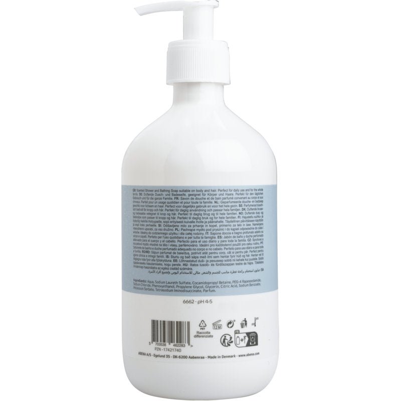 A white pump bottle with a blue label from Abena Re-Seller GmbH shows multilingual product and ingredient information for hair and body shampoo with perfume, 500 ml. At the bottom edge of the label are symbols and a barcode.