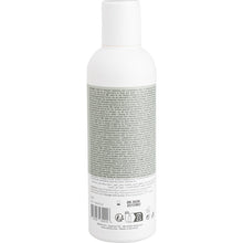 White plastic bottle with white cap, seen from the back. The label contains information and instructions about Abena Re-Seller GmbH hair and body shampoo "Washing without Water", 200 ml | Box (6 packs), as well as recycling and barcode symbols.
