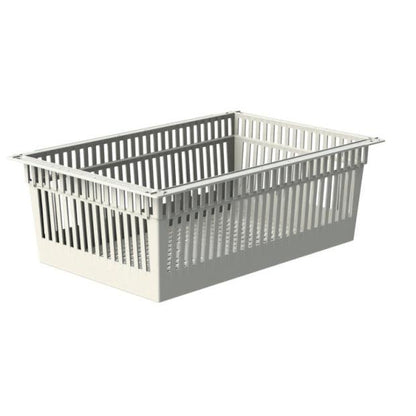 The Novocal ABS basket is a rectangular, light gray, divisible basket with a perforated bottom and pull-out stops, depicted at an angle against a white background.