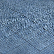 Close-up of the Arcora Floor-Clean microfiber floor cloth from Arcora International GmbH: a fabric surface with a grid of small, raised blue-gray squares, ideal for floor cleaning. The pack contains 10 pieces.