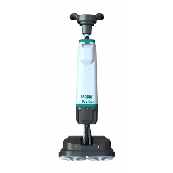 The white-gray Arcora Tiger 40 floor cleaning machine from Arcora International GmbH stands upright with two round brushes at the base and a control handle for professional floor cleaning. The delivery is made in a carton (1 piece).