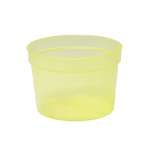 The AMPri PP medical cup 30 ml is a translucent yellow plastic measuring cup made of polypropylene with volume markings on the side. This cylindrically shaped cup has a consistent diameter from top to bottom and stands on a plain white background. The product is available in various colors and includes 2000 pieces per package. It is manufactured by AMPri Handelsgesellschaft mbH.