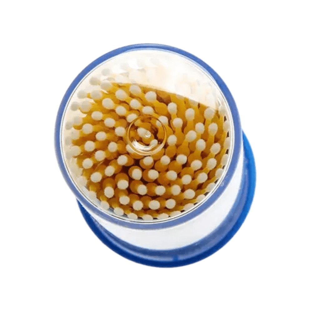 A top view shows the AMPri MED-COMFORT disposable micro applicators, ideal for precise work. These applicators are neatly arranged in a circular pattern, with white tips and brown stems. The transparent container has a blue base or lid, reminiscent of basic dental supply products.