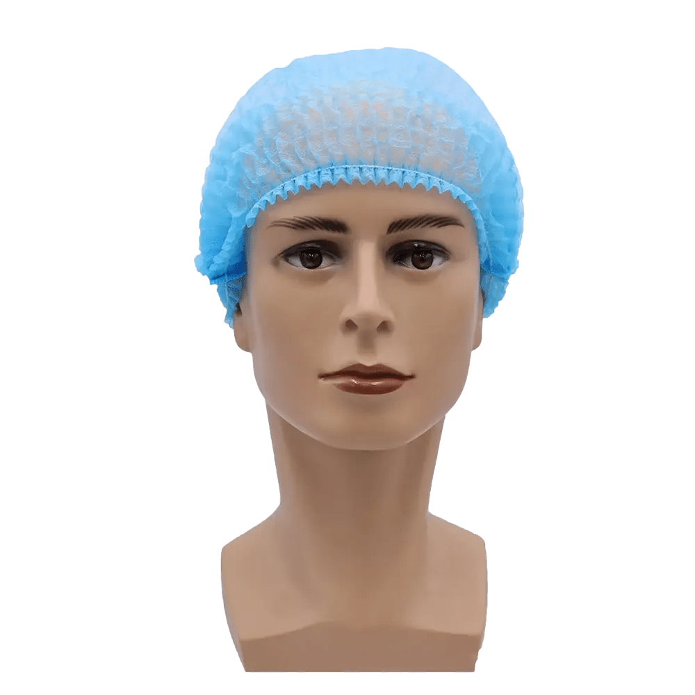 Pictured is a mannequin head with a disposable hairnet MED-COMFORT clip cap 52 cm by AMPri Handelsgesellschaft mbH in light blue. The head has a clean, smooth surface and neutral facial features, positioned against a plain white background, providing hygienic protection.