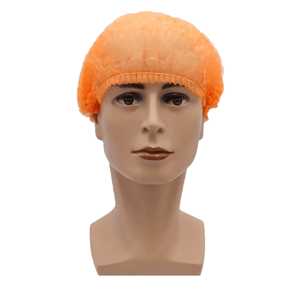 Pictured is a mannequin head with an orange AMPri MED-COMFORT clip cap 52 cm by AMPri Handelsgesellschaft mbH. The background is plain white. The polypropylene cap covers the entire head and fits snugly at the hairline, providing hygienic protection.