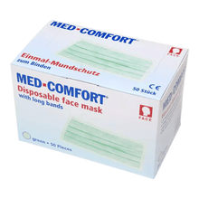A white box with the inscription "AMPri MED-COMFORT surgical mask for tying Type IIR" in blue and red lettering, containing 50 green masks from AMPri Handelsgesellschaft mbH. The box features CE and product-related symbols as well as the German text "Mundschutz Einwegprodukt zum Binden" (Disposable face mask for tying).
