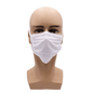A mannequin head wears a white AMPri MED-COMFORT surgical mask for tying Type IIR from AMPri Handelsgesellschaft mbH. The mask covers the nose and mouth and is attached to the head with ear loops. The plain white background perfectly highlights the design of this disposable face mask product.