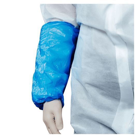 A close-up of a person wearing an AMPri MED-COMFORT PE sleeve protector, a blue polyethylene plastic sleeve that covers the arm from the wrist to above the elbow. The person is also wearing white protective clothing of PPE Category I, manufactured by AMPri Handelsgesellschaft mbH.
