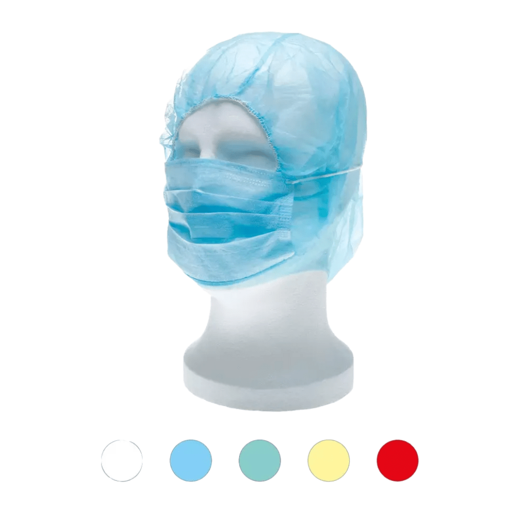 A white mannequin head wears a blue medical disposable cap and mask, resembling the AMPri MED-COMFORT PP astronaut hood with mouth protection. Below the mannequin are five small circles in different colors: white, light blue, blue, yellow, and red, highlighting the versatility of this polypropylene disposable product from AMPri Handelsgesellschaft mbH.