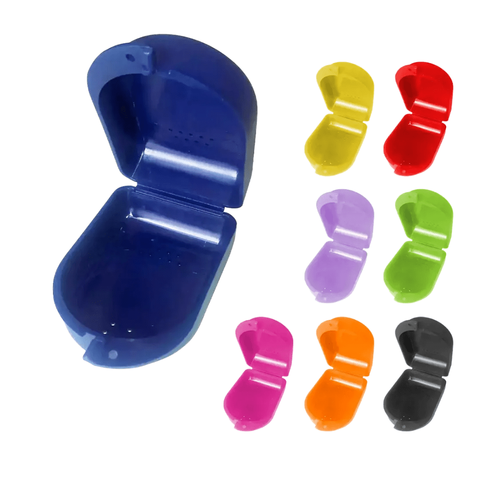 A collection of AMPri PP Dental braces boxes for children in various colors such as blue, yellow, red, purple, green, pink, orange, and black. These versatile storage boxes from AMPri Handelsgesellschaft mbH open with a hinge and have interior perforations.