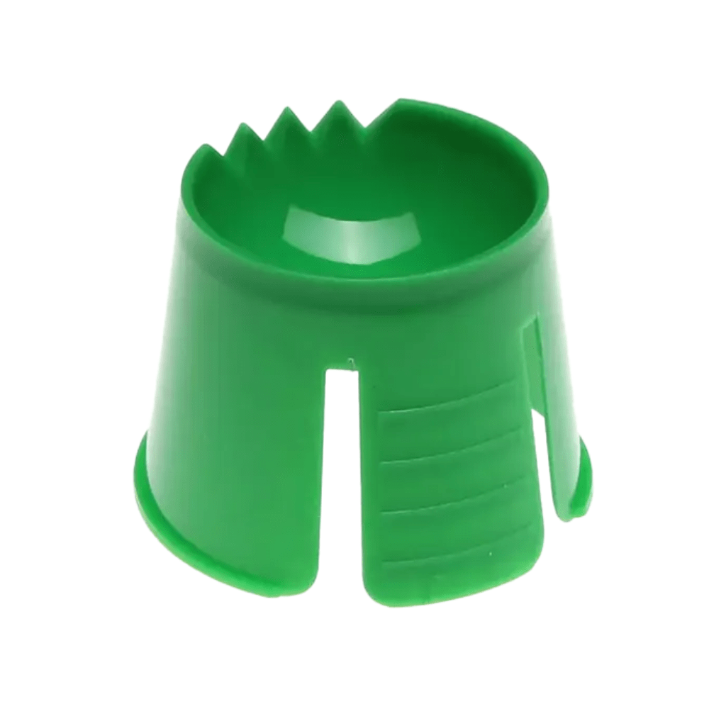 A green object made of AMPri polypropylene, resembling a conical cup with notches and slots at the upper edge, possibly used to secure or hold an item in place, serves as an ideal disposable dappen dish for mixing and portioning dental materials.