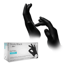 The image shows AMPri STYLE BLACK Nitrile Gloves Powder-Free by MED-COMFORT, Black, worn by a person in various positions over the glove compartment on their hands. The packaging with the brand name AMPri Handelsgesellschaft mbH indicates that the gloves are both powder-free and latex-free.