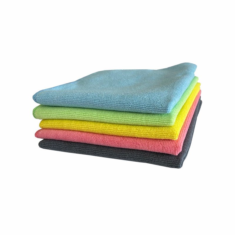 A stack of five Arcora SOFT-LINE MICROFIBER CLOTHS 40 x 40 cm from Arcora International GmbH in blue, green, yellow, pink, and black lies on white. These durable cloths ensure effective cleanliness with every use.