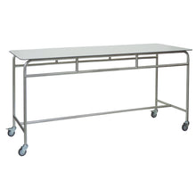 The Novocal work and storage table features a robust stainless steel frame and a white solid core material worktop, which is mobile with four swivel casters - perfect as a versatile table for professional use.