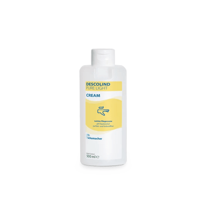 A white 500 ml plastic bottle of Dr. Schumacher GmbH Descolind Pure Light Cream care cream, fragrance-free for sensitive skin, has a yellow label with blue lettering and is photographed against a plain white background.