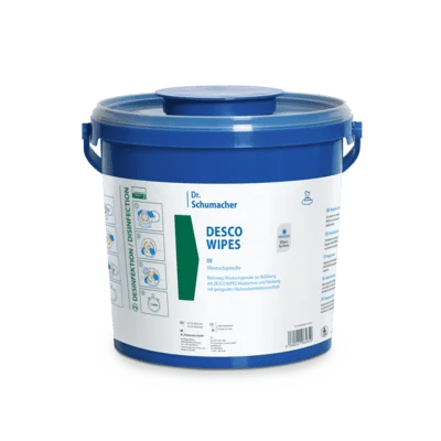 A large blue plastic container with a handle and round lid labeled "Dr. Schumacher DESCO WIPES BUCKET | Pack (6 pieces)" by Dr. Schumacher GmbH, with blue and green instructions for disinfectant wipes for surface cleaning.