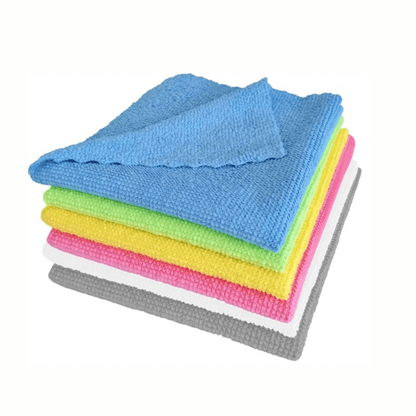 A stack of Arcora microfiber cloths ECO-LINE 2in1 in blue, green, yellow, pink, white, and gray from Arcora International GmbH is neatly arranged for surface disinfection. The textured blue cloth is on top of the stack, ensuring cleanliness and efficiency with every wipe.