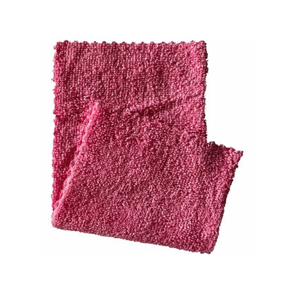 A folded pink knitted scarf lies on a white background, its textured surface resembling an Arcora microfiber cloth ECO-LINE 2in1. The rough edges enhance its charm and uniqueness.