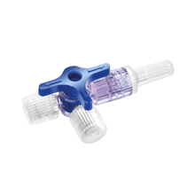 The B. Braun Discofix® three-way stopcock, manufactured by B. Braun Deutschland GmbH & Co. KG, is a medical three-way stopcock with a blue valve handle. It consists of three ports – two with transparent plastic caps and one with a pointed nozzle – and a clear central body with a blue lever for controlling fluid flow. This makes it ideal for precise infusion therapy applications.